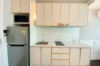 1 Bedroom Condo for Rent at Grand Florida Beachfront Condo Resort Pattaya compact kitchen with white gold-trim cabinets marble countertop and Samsung fridge
