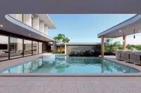 5 Bedroom House for Sale at Gravity Prime Pattaya swimming pool area with outdoor bar and seating.
