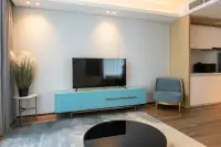 1 Bedroom Condo for Rent at Beverly Mountain Bay Pattaya lounge corner with flat-screen TV and blue cabinet