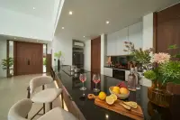 3 Bedroom House for Sale at Sunplay Bangsaray modern kitchen island with wine glasses and fresh fruit