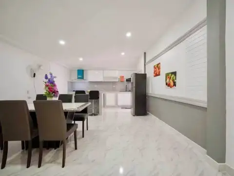 4 Bedroom House for Sale at Raviporn City Home open-plan dining area with view into kitchen