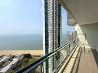 1 Bedroom Condo for Sale at Reflection Jomtien Beach balcony view of neighboring tower and coastline