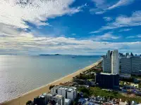2 Bedroom Condo for Sale at Reflection Jomtien Beach aerial view of coastline, beach and high-rise buildings