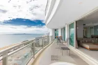 3 Bedroom Condo for Sale at Reflection Jomtien Beach wraparound balcony with coastline and city skyline view