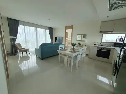 2 Bedroom Condo for Sale at The Riviera Jomtien open-plan living and dining area with built-in kitchen and city view