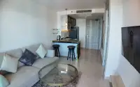 1 Bedroom Condo for Sale & Rent at Riviera Monaco open-plan living area with kitchenette and hallway