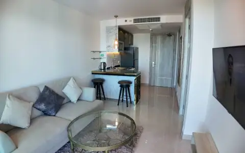 1 Bedroom Condo for Sale & Rent at Riviera Monaco open-plan living area with kitchenette and hallway