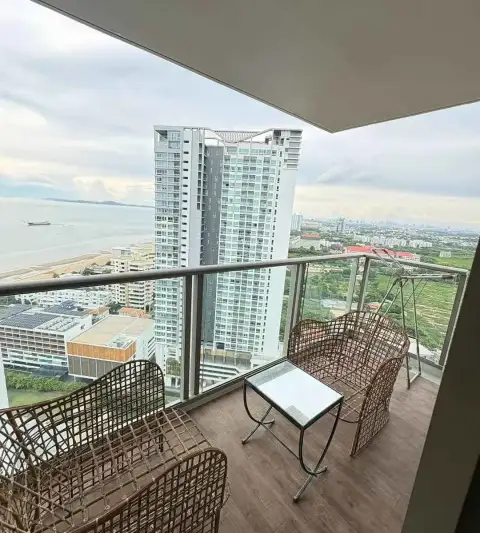 1 Bedroom Condo for Rent at Riviera Monaco balcony seating area overlooking ocean and coastal skyline