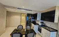 2 Bedroom Condo for Sale & Rent at Riviera Monaco marble kitchen with built-in oven, sink and dining area near hallway