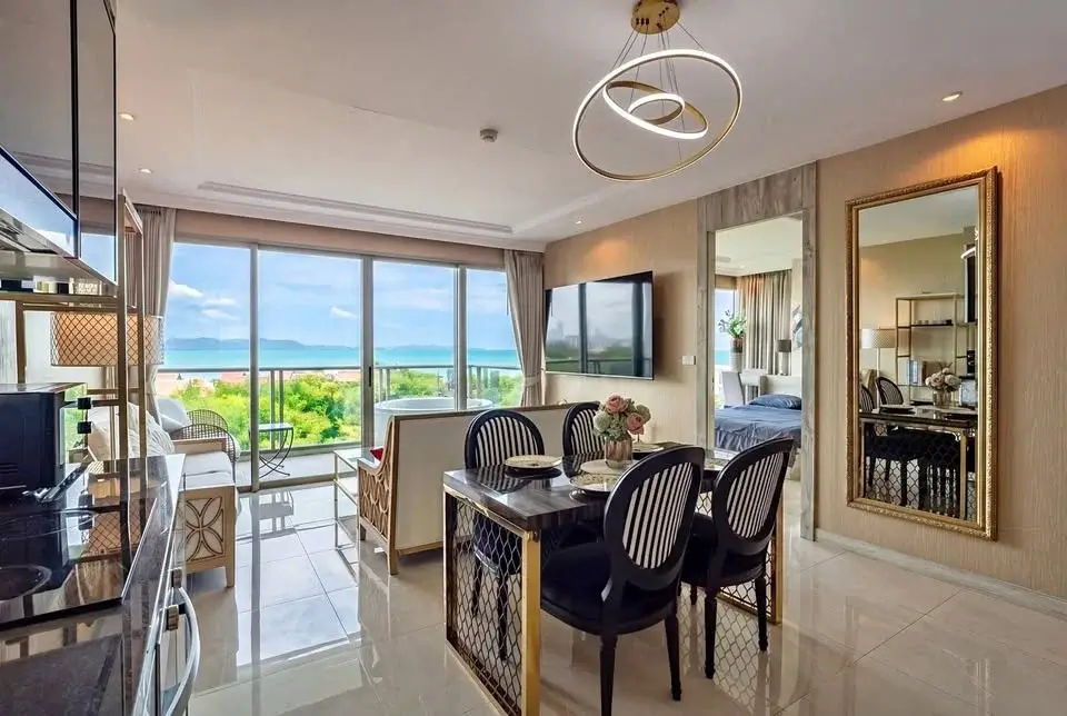 2 Bedroom Condo for Sale at Riviera Monaco dining area with ocean view and round chandelier