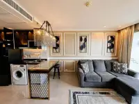 1 Bedroom Condo for Sale at Riviera Monaco open-plan living area with kitchen and decorative wall panels