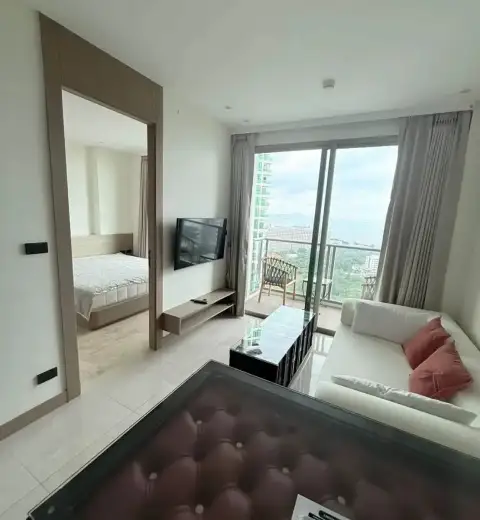 1 Bedroom Condo for Rent at Riviera Ocean Drive open living area with bedroom access and ocean view balcony