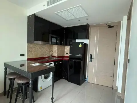 1 Bedroom Condo for Rent at Riviera Ocean Drive compact kitchen with dining table and entrance door