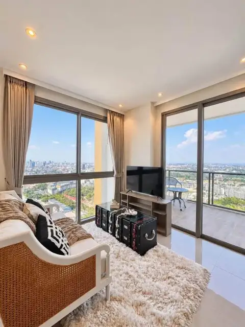 1 Bedroom Condo for Rent at Riviera Ocean Drive open living area with floor-to-ceiling windows and balcony access