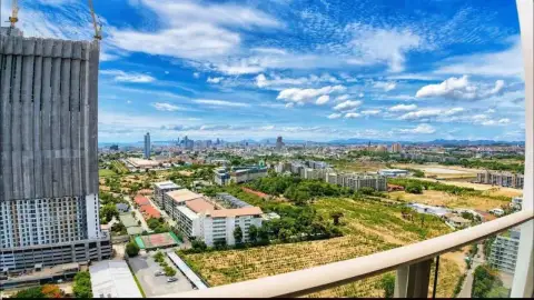 1 Bedroom Condo for Rent at Riviera Ocean Drive high-rise balcony view of Pattaya city and green landscape