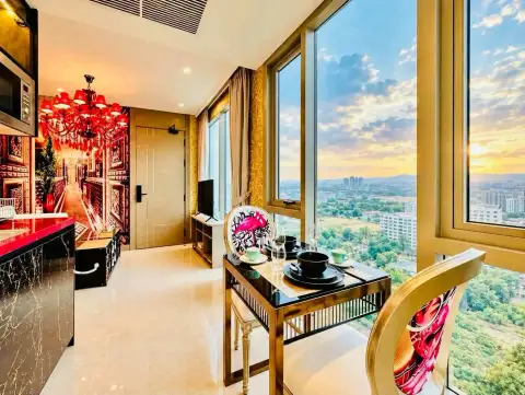 1 Bedroom Condo for Rent at Riviera Ocean Drive dining table set for two with sunset city skyline view