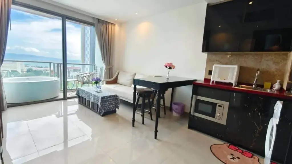 1 Bedroom Condo for Rent at Riviera Ocean Drive living room with balcony jacuzzi tub and open kitchen