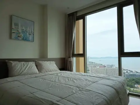 1 Bedroom Condo for Rent at Riviera Ocean Drive bedroom with king bed and panoramic sea view windows