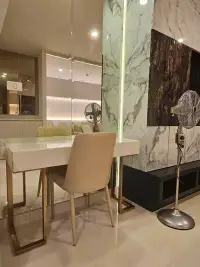 1 Bedroom Condo for Rent at Riviera Wong Amat Beach vanity desk with mirror and standing fan