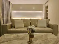 1 Bedroom Condo for Rent at Riviera Wong Amat Beach beige sofa with cushions and marble coffee table
