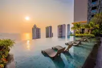 2 Bedroom Condo for Sale at Riviera Wong Amat Beach rooftop infinity pool overlooking ocean at sunset