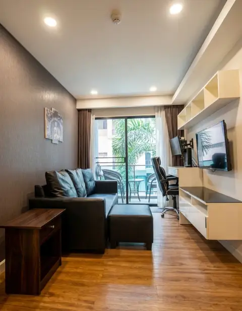 1 Bedroom Condo for Sale at Dusit Grand Park 1 open-plan living area with wood flooring and balcony view