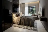 3 Bedroom Condo for Sale at Zenith 2: Outdoor lounge chairs by a large swimming pool surrounded by palm trees and buildings.