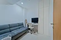 2 Bedroom Condo for Sale at The Sanctuary Wongamat study nook with desk, chair and gray sofa