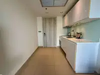Studio Condo for Sale at Sands Condominium hallway entrance with tiled floor and kitchenette along the wall