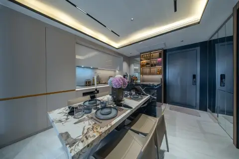 2 Bedroom Condo for Sale at Sea Sky By Sand master bedroom with king bed, floor-to-ceiling sheer curtains, and built-in shelving