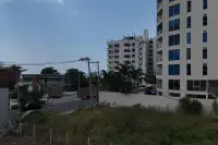 1 Bedroom Condo for Sale at Sea Sky By Sand street view of neighboring buildings and tropical surroundings in Pattaya