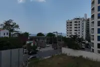 1 Bedroom Condo for Sale at Sea Sky By Sand balcony view of Pattaya cityscape and distant sea