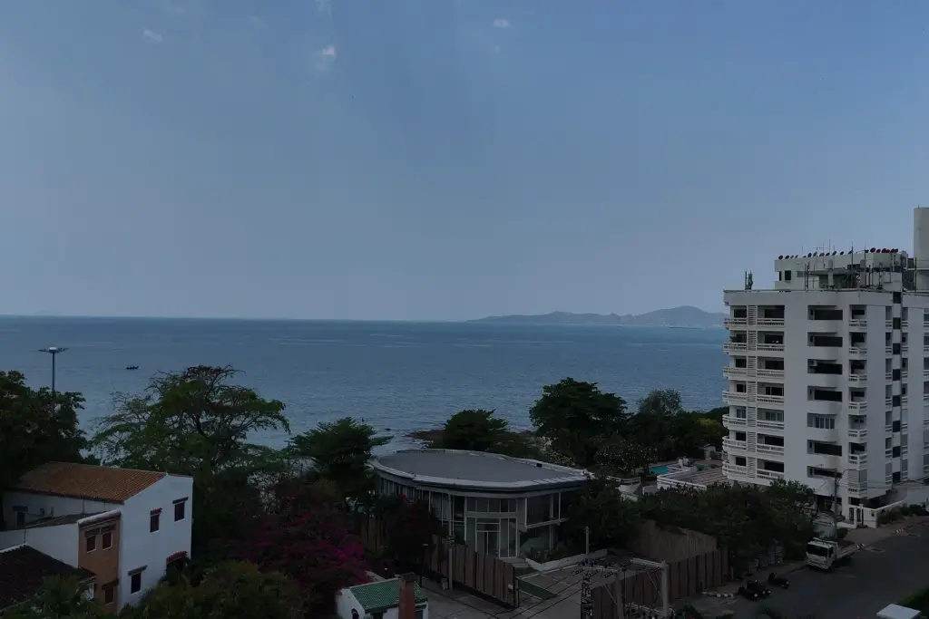 1 Bedroom Condo for Sale at Sea Sky By Sand elevated sea view overlooking Pattaya coastline and high-rise buildings