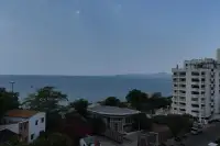 1 Bedroom Condo for Sale at Sea Sky By Sand elevated sea view overlooking Pattaya coastline and high-rise buildings