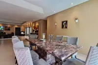 4 Bedroom House for Sale & Rent at Sedona Villas 1 dining area with marble table and framed wall art