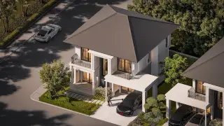 Serene Home: Aerial view of a modern white house with a dark roof, carport, and green landscaping.