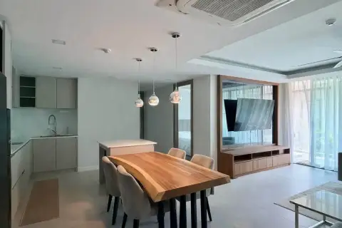 2 Bedroom Condo for Rent at Serenity Residence Jomtien open-plan dining area and living room with wall-mounted TV