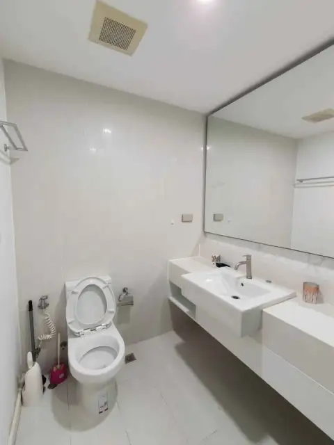 1 Bedroom Condo for Sale at Seven Seas Condo Resort bathroom with toilet, vanity sink and large mirror