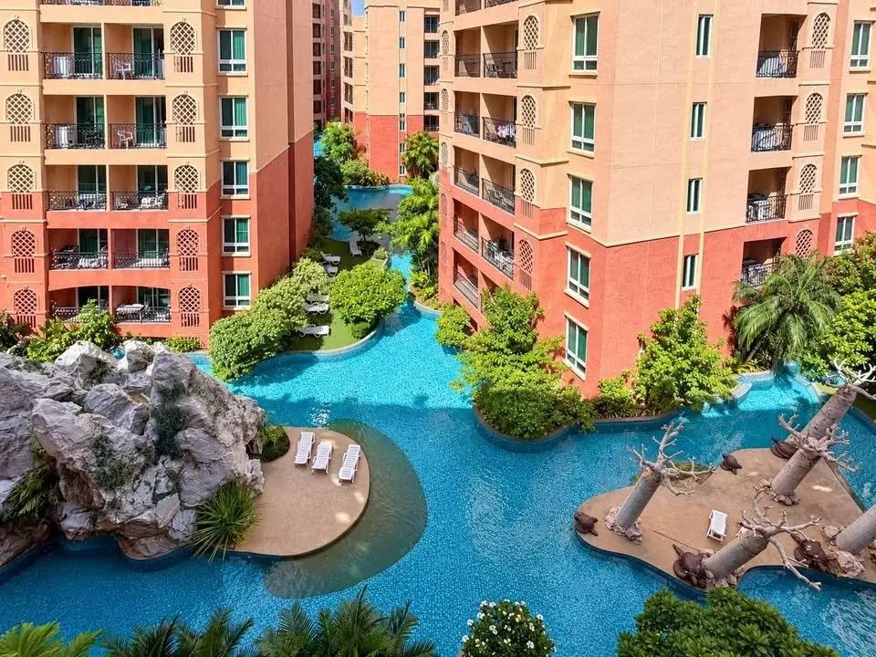2 Bedroom Condo for Sale at Seven Seas Condo Resort aerial view of lagoon pool with rock features and lush gardens