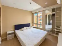 2 Bedroom Condo for Sale at Seven Seas Condo Resort bedroom with blue headboard bed and mirrored closet