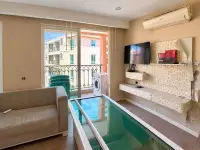 2 Bedroom Condo for Sale at Seven Seas Condo Resort living room with glass coffee table and balcony pool view