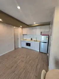 1 Bedroom Condo for Sale at Seven Seas Condo Resort kitchenette with refrigerator, sink, and built-in cabinets