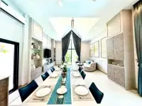 3 Bedroom House for Sale & Rent in Mabprachan dining room with long table set for eight and lounge area