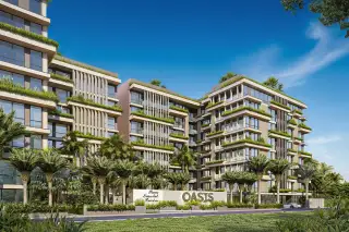 Siam Oriental Oasis modern condo buildings with green landscaping on balconies and rooftops, seen from a street view.