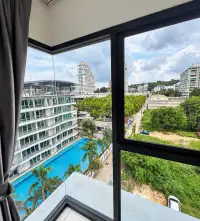 2 Bedroom Condo for Rent at Siam Oriental Plaza corner window view of swimming pool and Pattaya skyline