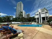 2 Bedroom Condo for Sale at Siam Penthouse 3 outdoor swimming pool with lounge chairs and city skyline view
