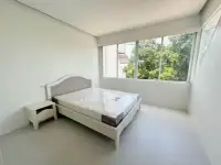 2 Bedroom Condo for Sale at Siam Penthouse 3 bright bedroom with double bed and large window overlooking greenery