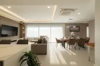 3 Bedroom Condo for Sale at Zensiri Estates and Residences spacious living and dining area with large floor-to-ceiling sheer curtains