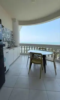Studio Condo for Sale at Sky Beach balcony kitchenette with dining table and ocean view