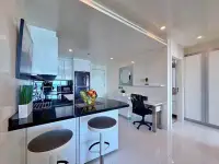 1 Bedroom Condo for Sale at Sky Residences Pattaya kitchen island with bar stools and study desk